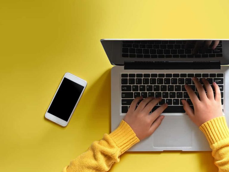 woman-hands-using-a-laptop-computer-from-above-2021-09-04-06-44-08-utc (1)